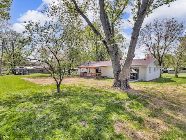 view of yard with a wooden deck
