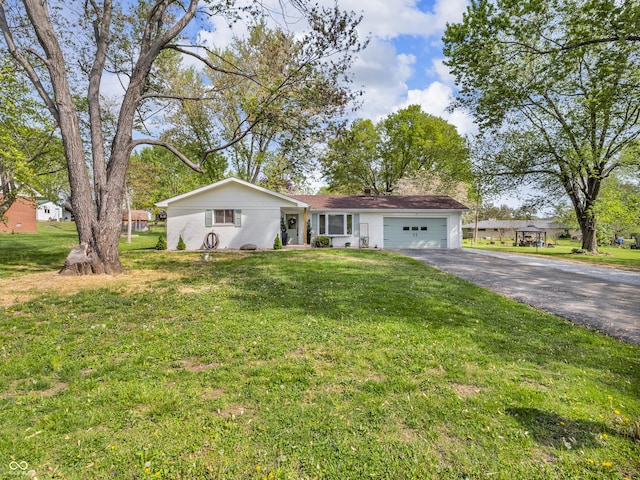 single story home with an attached garage, driveway, and a front yard