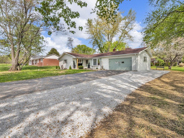 ranch-style home with a garage, a chimney, a front yard, and gravel driveway