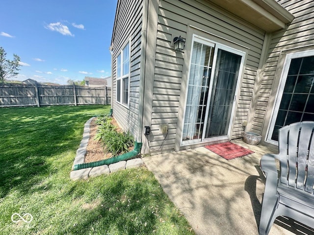 view of patio featuring fence