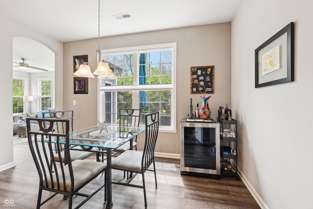 9359 Foudray Cir N, Avon, IN 46123 - dining space with wine cooler, plenty of natural light, and dark wood-type flooring