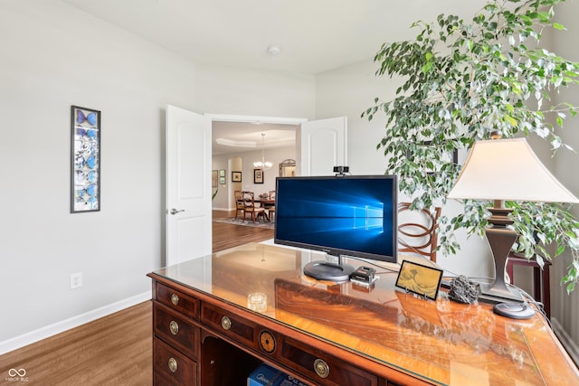 9359 Foudray Cir N, Avon, IN 46123 - home office featuring wood finished floors, baseboards, and a chandelier