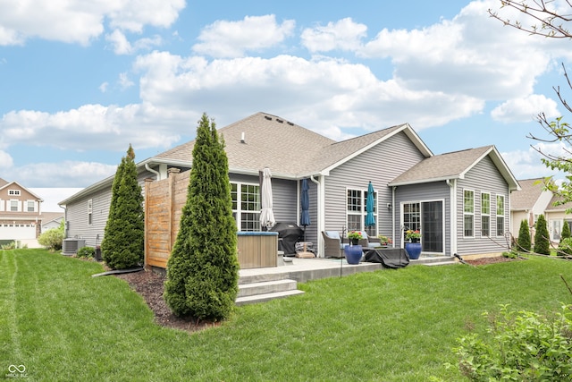 9359 Foudray Cir N, Avon, IN 46123 - rear view of house featuring a patio area, a lawn, central AC unit, and a shingled roof