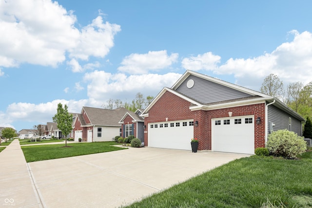 9359 Foudray Cir N, Avon, IN 46123 - view of front of house featuring an attached garage, brick siding, driveway, and a front yard