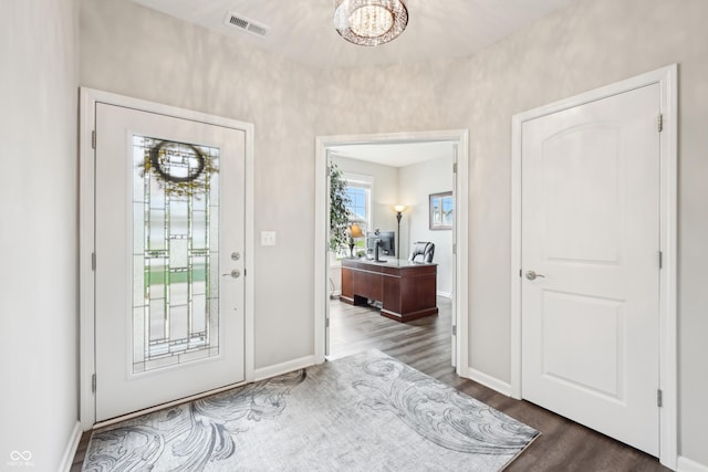 9359 Foudray Cir N, Avon, IN 46123 - foyer with dark wood-type flooring, a chandelier, and baseboards