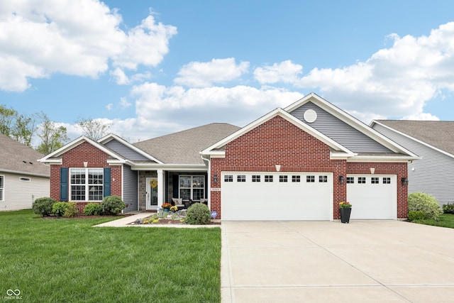 9359 Foudray Cir N, Avon, IN 46123 - view of front of home with an attached garage, a front yard, driveway, and brick siding