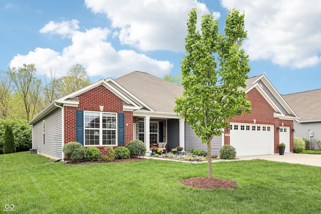 9359 Foudray Cir N, Avon, IN 46123 - view of front of home featuring brick siding, driveway, a garage, and a front yard