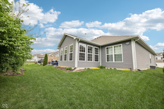 9359 Foudray Cir N, Avon, IN 46123 - rear view of house featuring a yard
