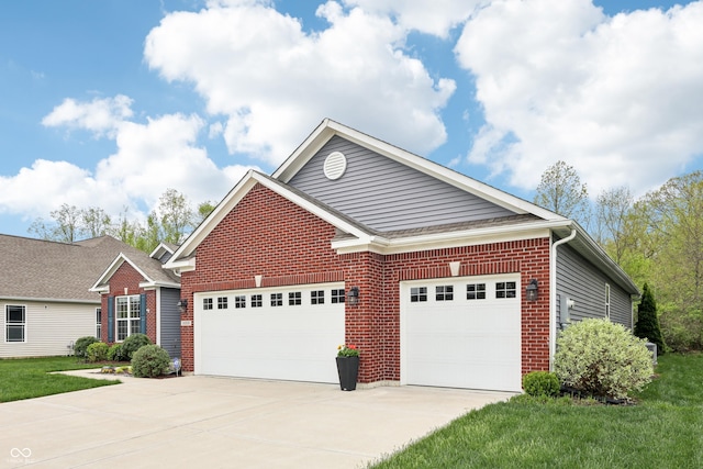 9359 Foudray Cir N, Avon, IN 46123 - view of front of house featuring a garage, driveway, brick siding, and a front lawn