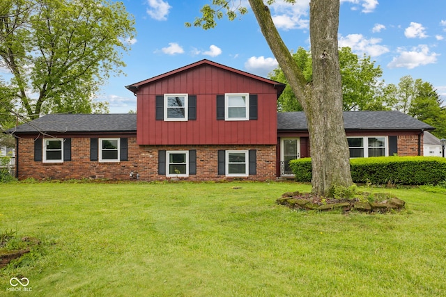 6123 W 46th St, Indianapolis, IN 46254 - split level home featuring brick siding, a front lawn, and board and batten siding