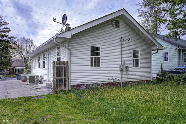 view of side of home with cooling unit