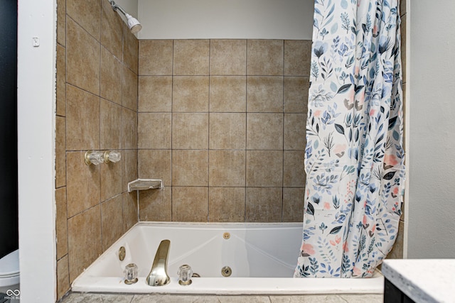 bathroom with vanity and a combined bath / shower with jetted tub
