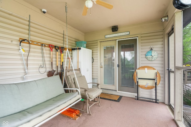sunroom featuring plenty of natural light and ceiling fan
