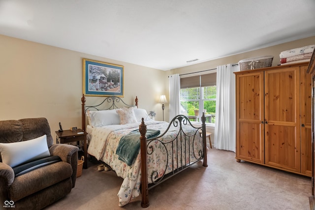 bedroom with light colored carpet