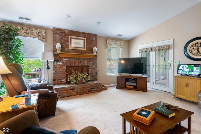 living room with visible vents, light carpet, lofted ceiling, and a fireplace