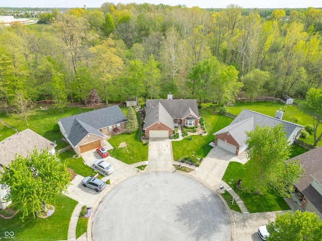 bird's eye view featuring a view of trees and a residential view