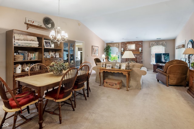 dining room with an inviting chandelier, lofted ceiling, and light colored carpet