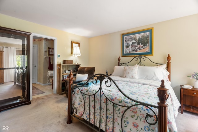 bedroom with light colored carpet