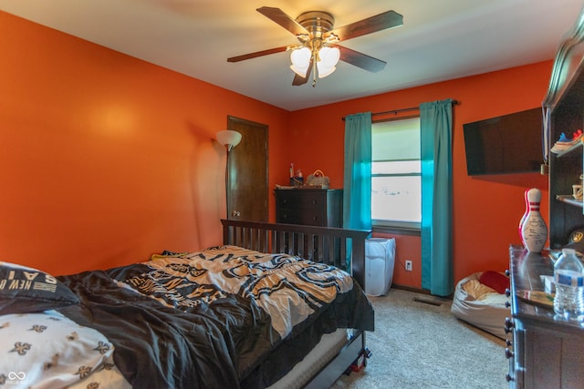bedroom with visible vents, carpet, and ceiling fan