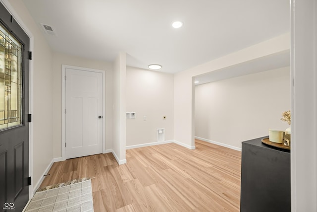 basement featuring recessed lighting, baseboards, visible vents, and light wood-style flooring