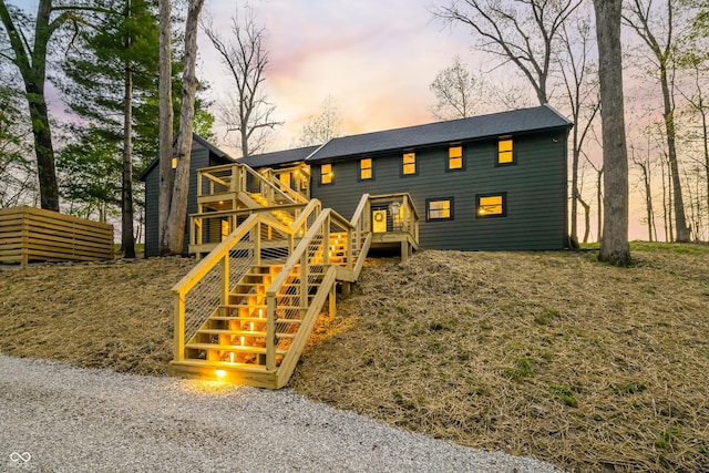 exterior space featuring a wooden deck and stairway
