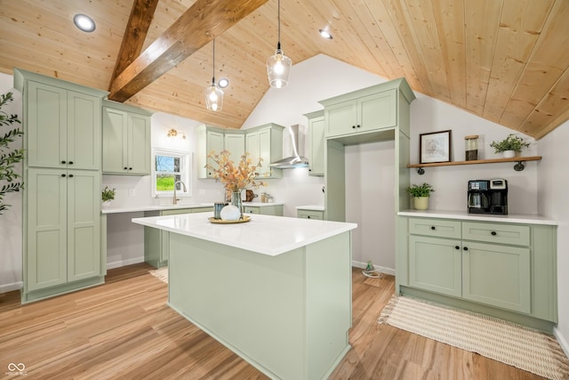 kitchen with light wood-style floors, wall chimney range hood, vaulted ceiling with beams, wood ceiling, and green cabinets