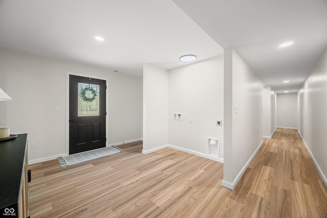 foyer entrance featuring light wood-type flooring, recessed lighting, and baseboards