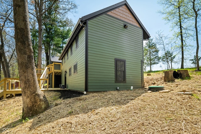 view of home's exterior featuring a deck