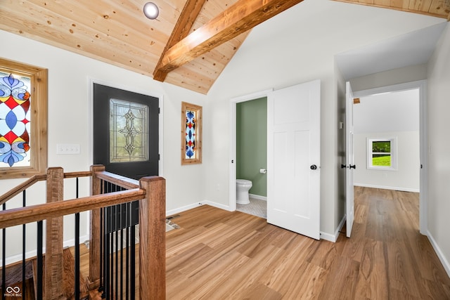 corridor featuring an upstairs landing, wooden ceiling, vaulted ceiling with beams, and light wood-type flooring