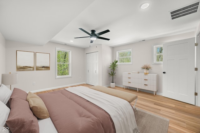 1526 Curly Shingles Rd, Nashville, IN 47448 - bedroom featuring recessed lighting, light wood-style flooring, baseboards, a ceiling fan, and a closet