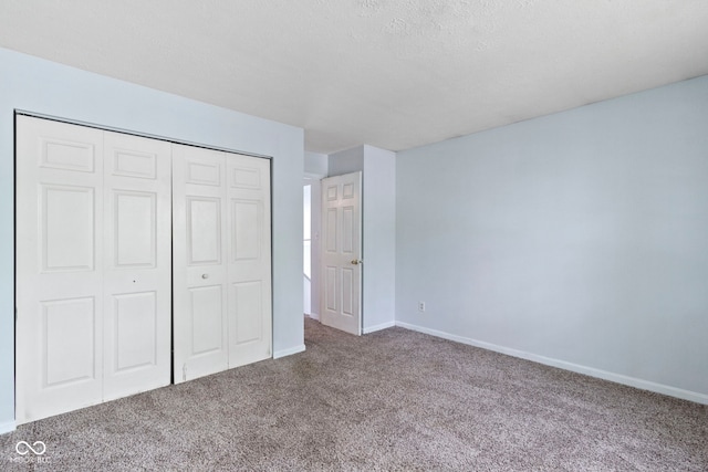 6638 Sunbury Dr, Indianapolis, IN 46241 - unfurnished bedroom with a closet, carpet, and baseboards