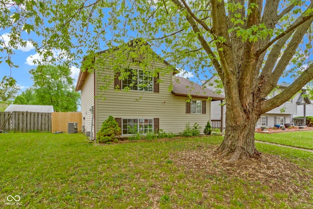6638 Sunbury Dr, Indianapolis, IN 46241 - exterior space with central air condition unit, fence, and a front yard