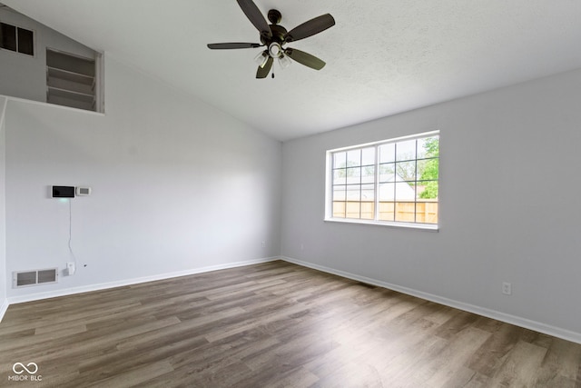 6638 Sunbury Dr, Indianapolis, IN 46241 - empty room with ceiling fan, lofted ceiling, wood finished floors, and visible vents