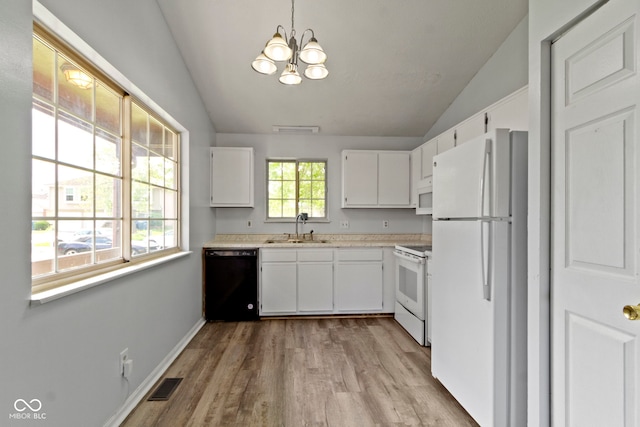 6638 Sunbury Dr, Indianapolis, IN 46241 - kitchen featuring a sink, visible vents, white appliances, light countertops, and vaulted ceiling