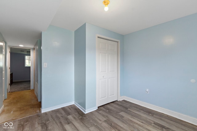 6638 Sunbury Dr, Indianapolis, IN 46241 - unfurnished bedroom with baseboards and wood finished floors