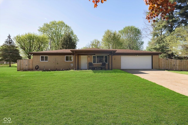 single story home featuring concrete driveway, fence, a front yard, and a garage