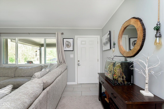 living room with baseboards, ornamental molding, and light tile patterned floors