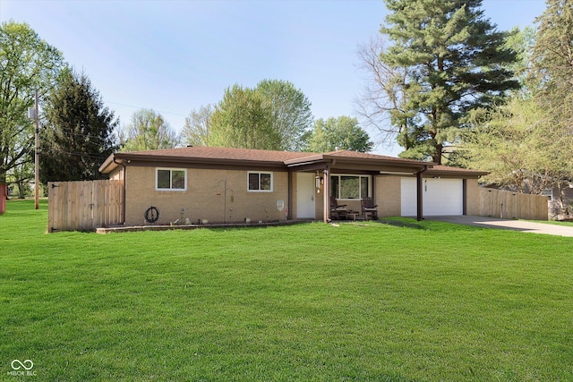 single story home with driveway, a front lawn, and a garage