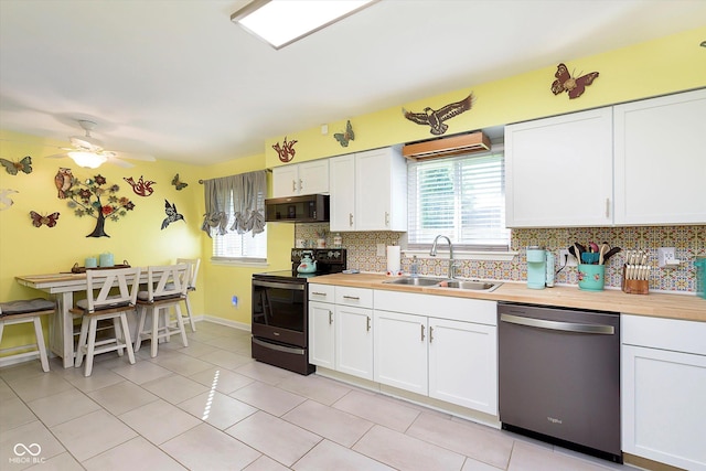 kitchen featuring electric range oven, plenty of natural light, a sink, and dishwasher