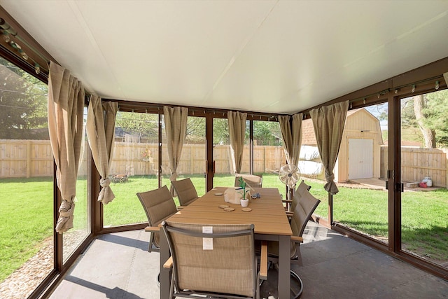 sunroom with a wealth of natural light and outdoor dining space