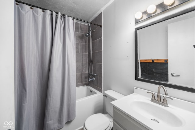 bathroom featuring toilet, shower / bath combo, vanity, and a textured ceiling