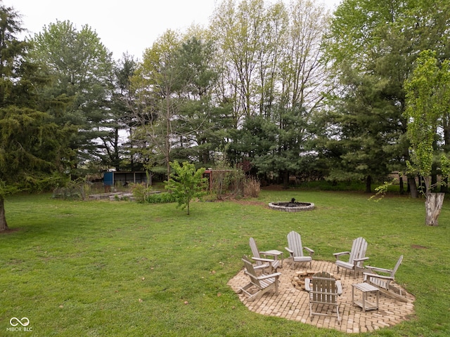 view of yard featuring a patio area and a fire pit