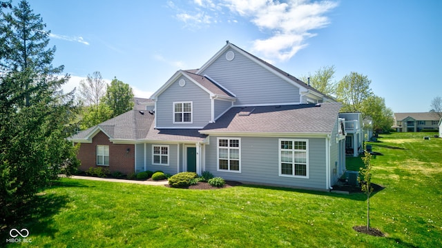 traditional-style home featuring central AC and a front lawn