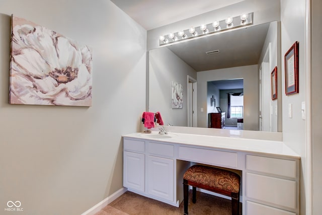 bathroom with vanity, baseboards, and visible vents