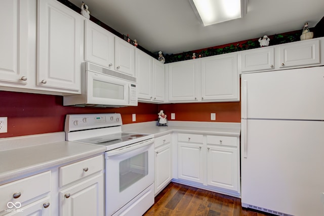 kitchen featuring white appliances, white cabinets, dark wood-type flooring, and light countertops