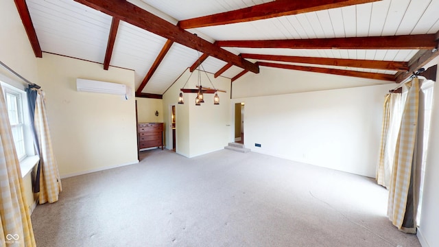 unfurnished living room with lofted ceiling with beams, baseboards, a wall unit AC, and light carpet