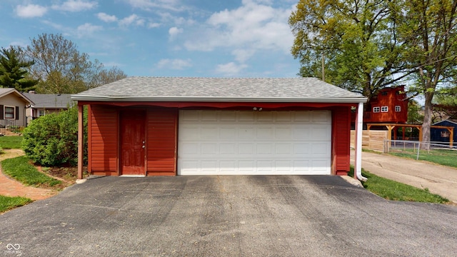 garage with fence