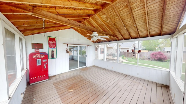 unfurnished sunroom featuring a ceiling fan