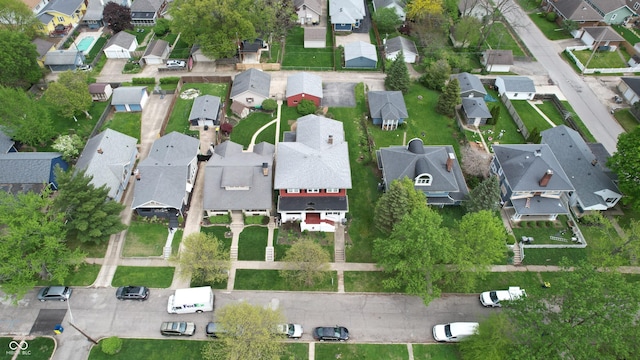 birds eye view of property with a residential view