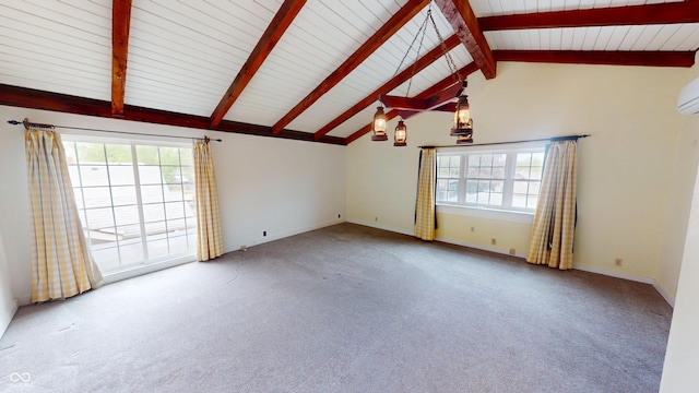 unfurnished room featuring vaulted ceiling with beams, carpet, and a wealth of natural light